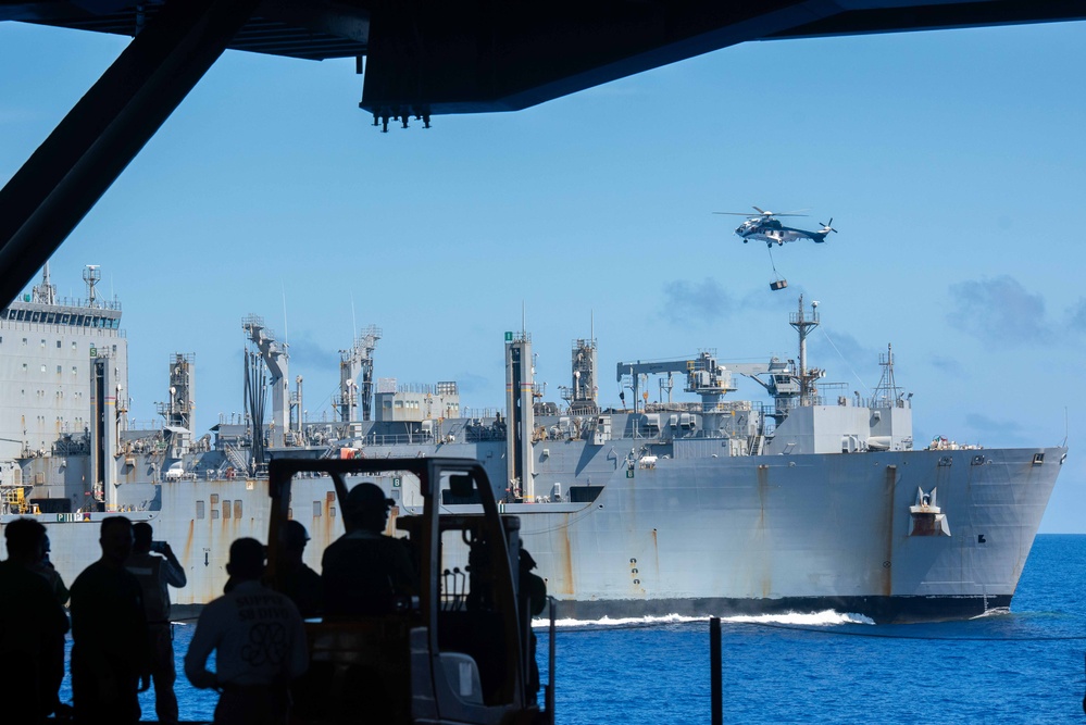 USS Ronald Reagan (CVN 76) conducts replenishment-at-sea with USNS Yukon (T-AO 202) and USNS Carl Brashear (T-AKE 7)