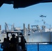 USS Ronald Reagan (CVN 76) conducts replenishment-at-sea with USNS Yukon (T-AO 202) and USNS Carl Brashear (T-AKE 7)