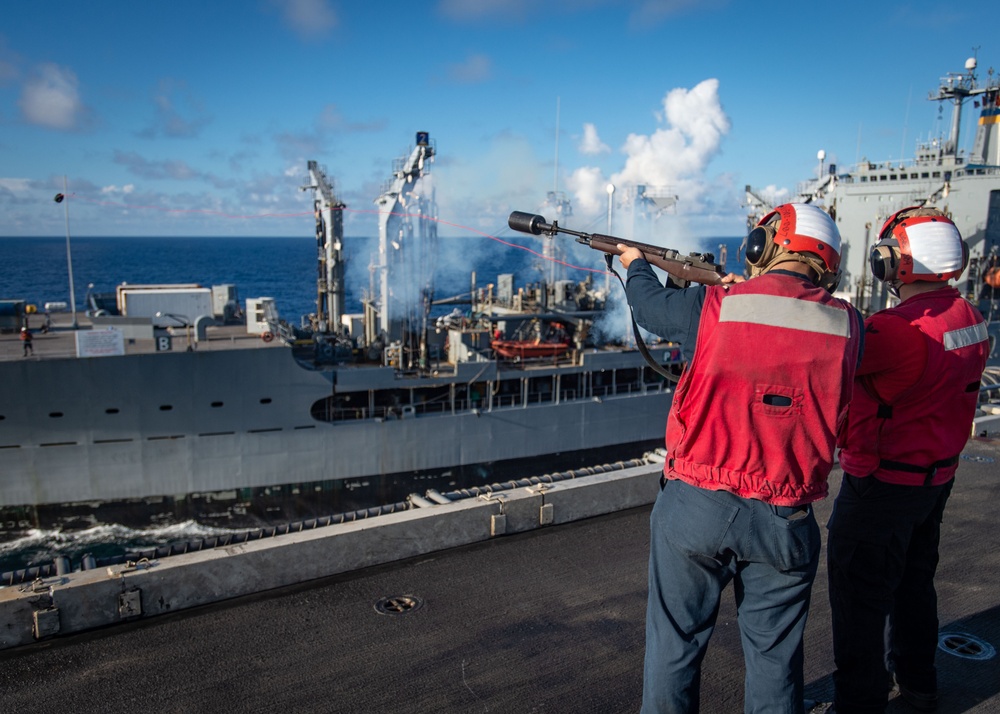 USS Ronald Reagan (CVN 76) conducts replenishment-at-sea with USNS Yukon (T-AO 202) and USNS Carl Brashear (T-AKE 7)