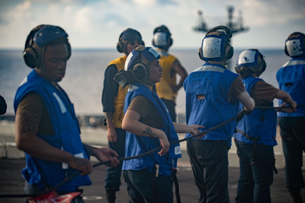 USS Ronald Reagan (CVN 76) conducts replenishment-at-sea with USNS Yukon (T-AO 202) and USNS Carl Brashear (T-AKE 7)