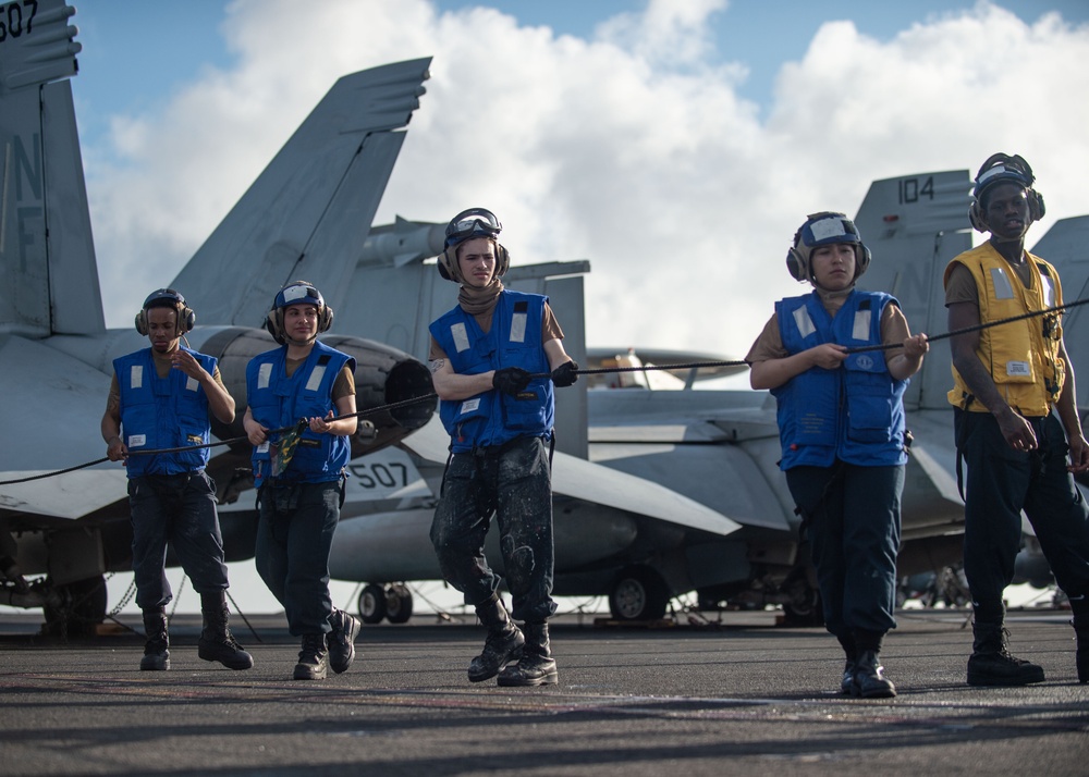 USS Ronald Reagan (CVN 76) conducts replenishment-at-sea with USNS Yukon (T-AO 202) and USNS Carl Brashear (T-AKE 7)