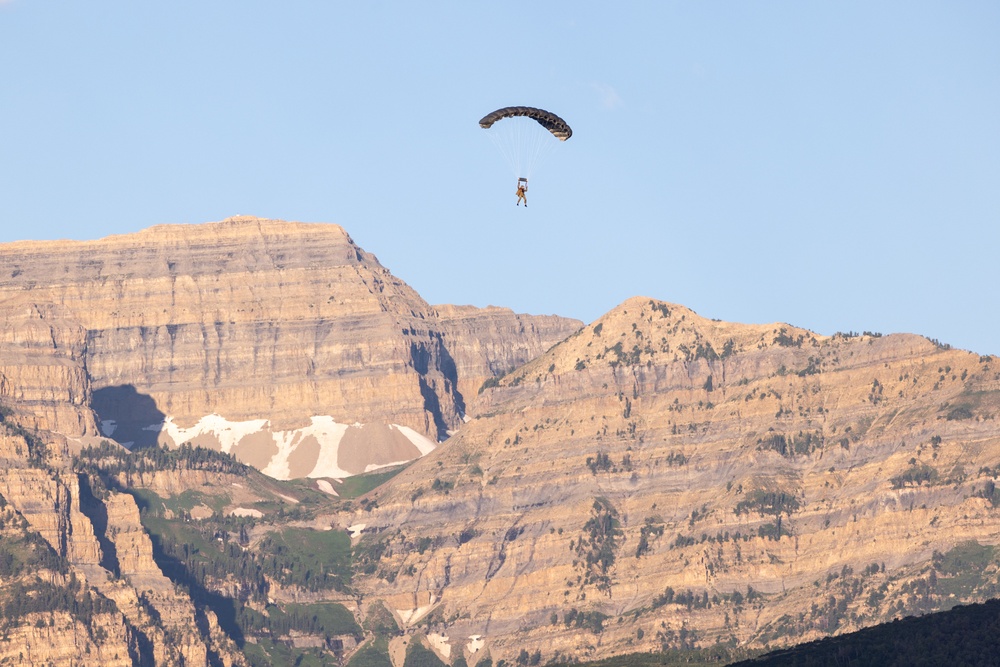 Soldiers with the 19th Special Forces Group (Airborne) parachute into Deer Creek Reservoir near Heber City, Utah