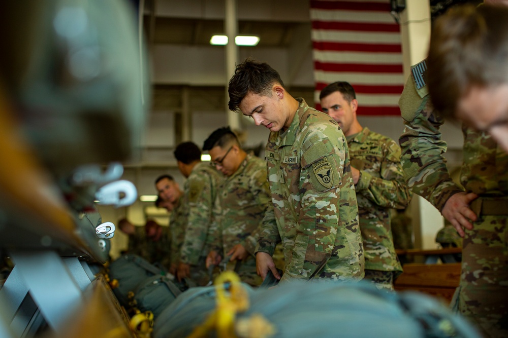 VMGR-152 and 11th Airborne Division execute static line jumps