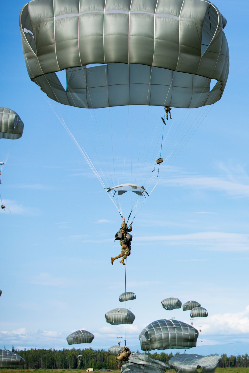 VMGR-152 and 11th Airborne Division execute static line jumps