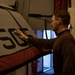 Sailor Cleans a Jet Aboard USS Carl Vinson (CVN 70)