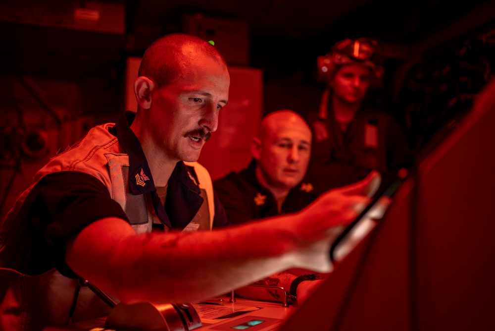 USS Carl Vinson (CVN 70) Sailor Conducts Prechecks For A Jet Engine Test