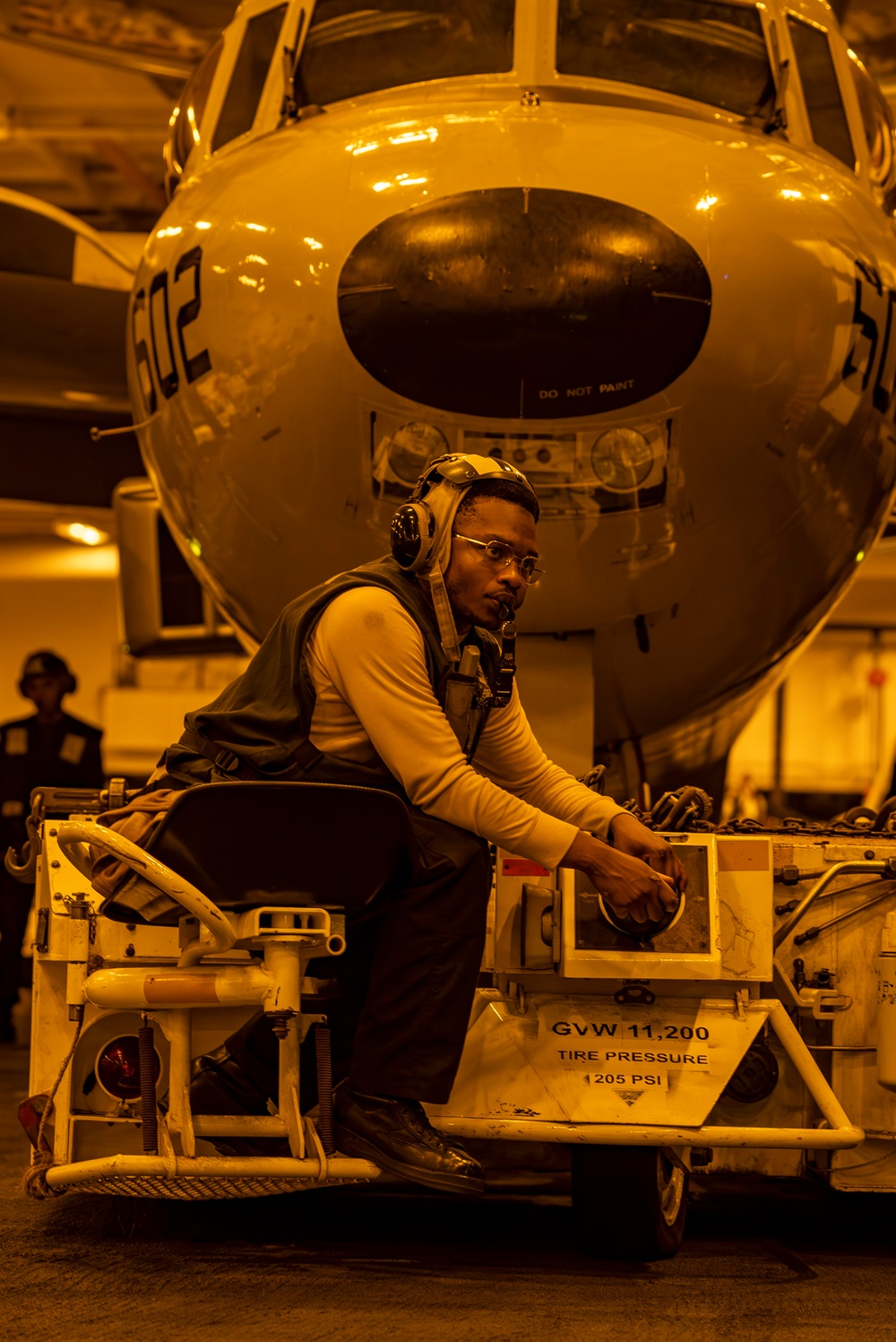 USS Carl Vinson (CVN 70) Sailor Taxis An E-2D Advanced Hawkeye