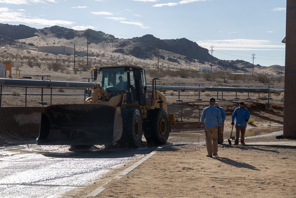 The Combat Center Public Works Division clear up debris after Tropical Storm Hilary