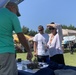 Visitors stop by Naval Museum's outreach booth