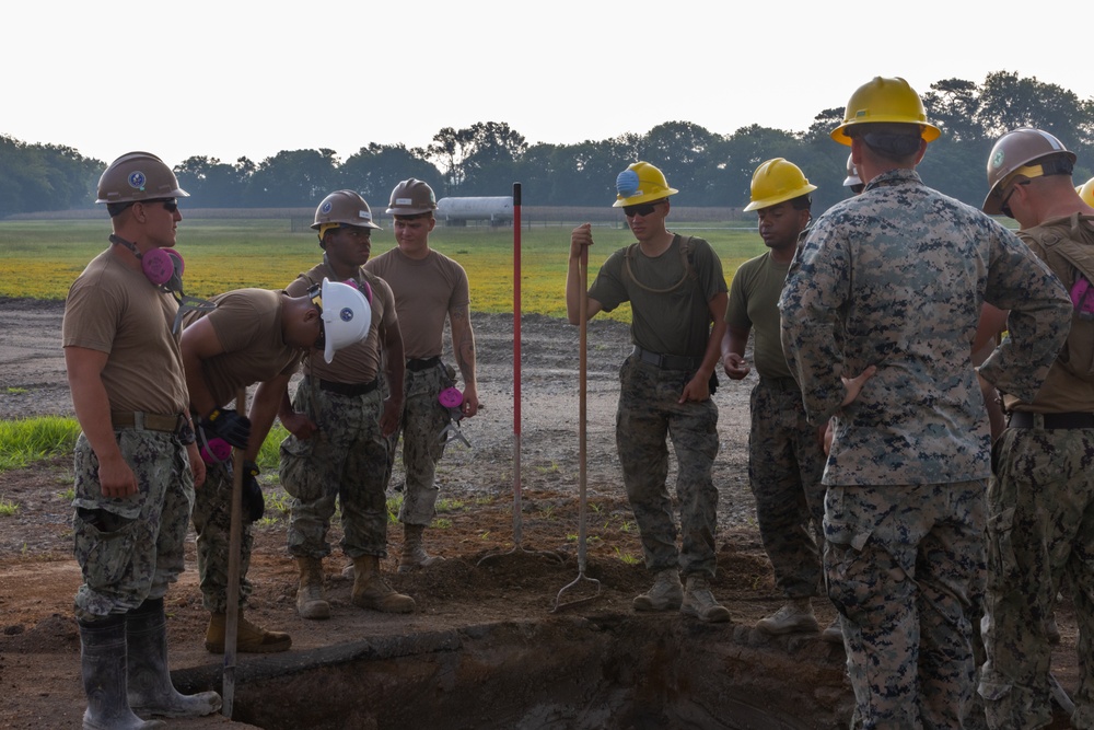 Marine Wing Support Squadron 272 works alongside Naval Mobile Construction Battalion 11 to conduct airfield damage repair