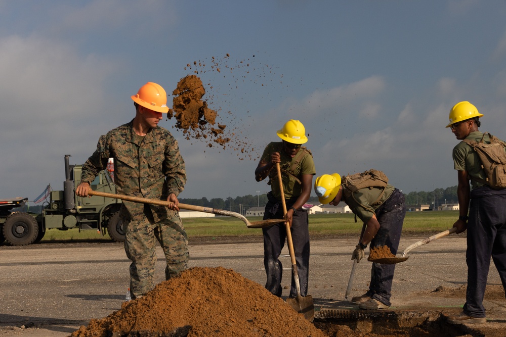 Marine Wing Support Squadron 272 works alongside Naval Mobile Construction Battalion 11 to conduct airfield damage repair