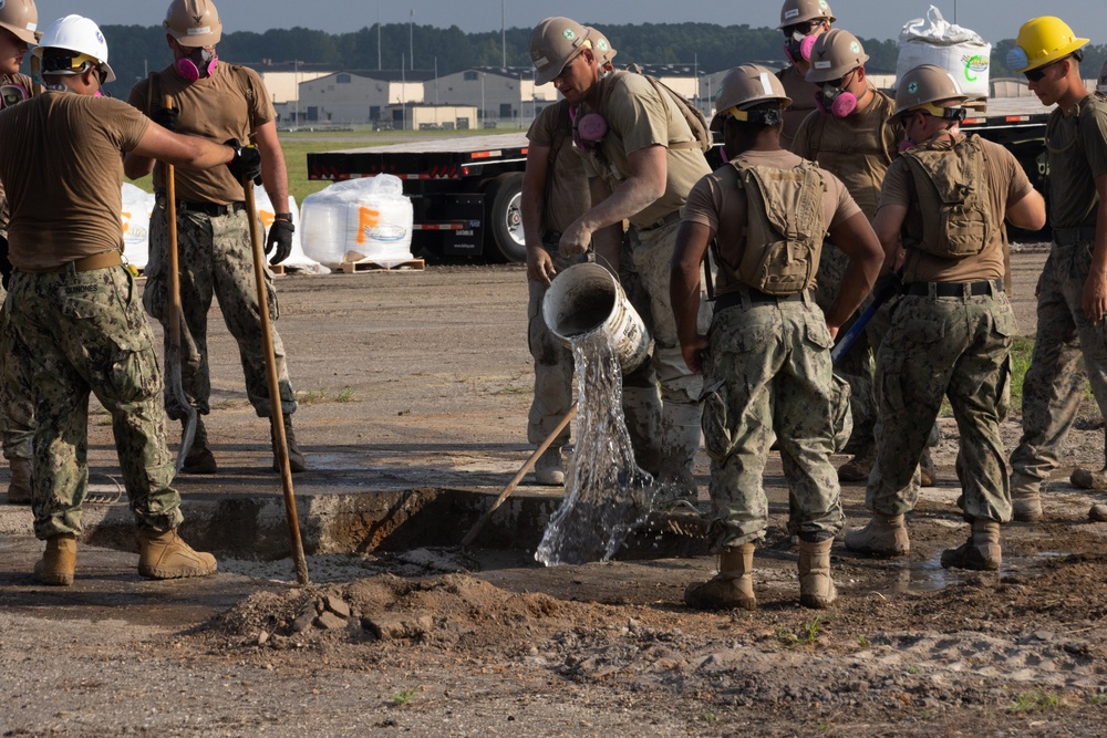 Marine Wing Support Squadron 272 works alongside Naval Mobile Construction Battalion 11 to conduct airfield damage repair