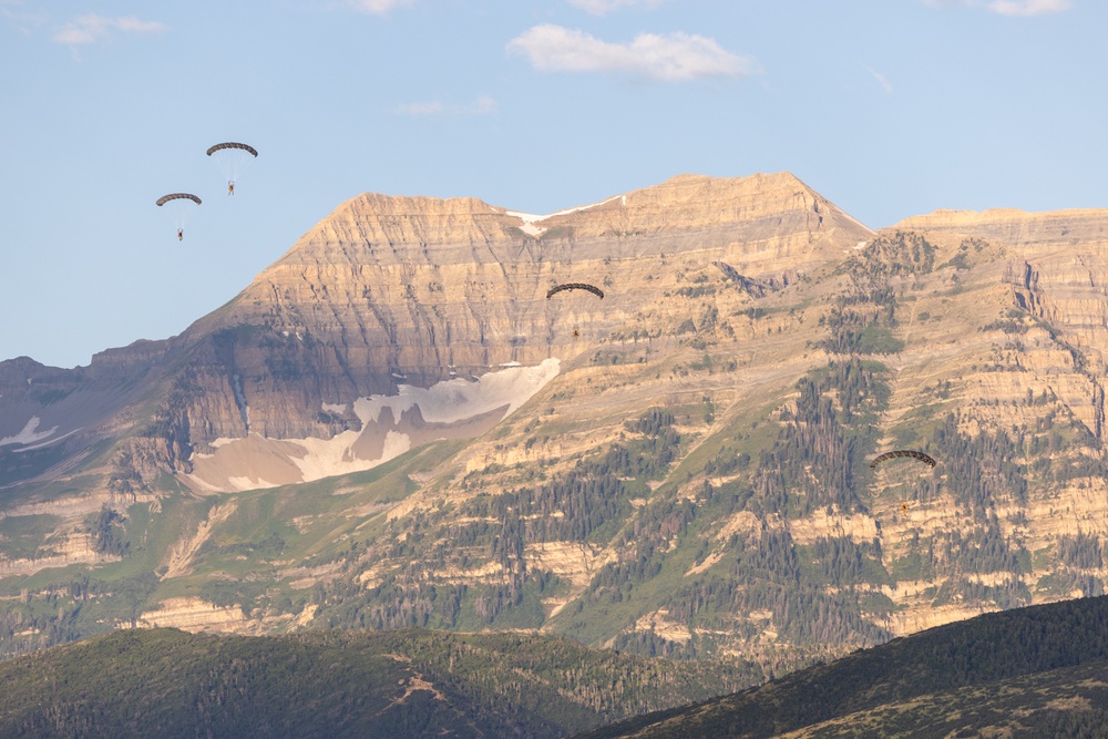 Soldiers with the 19th Special Forces Group (Airborne) parachute into Deer Creek Reservoir near Heber City, Utah