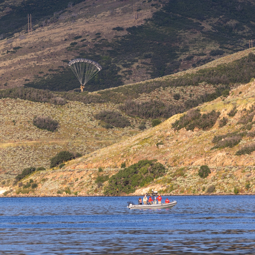 Soldiers with the 19th Special Forces Group (Airborne) parachute into Deer Creek Reservoir near Heber City, Utah