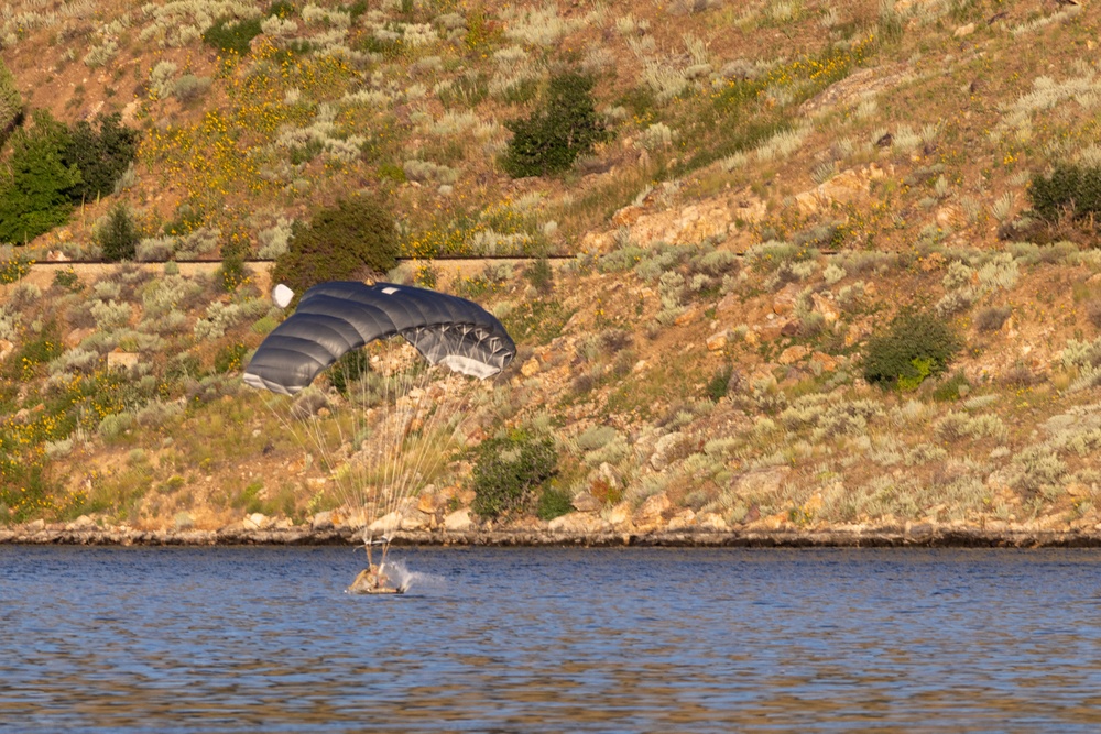 Soldiers with the 19th Special Forces Group (Airborne) parachute into Deer Creek Reservoir near Heber City, Utah