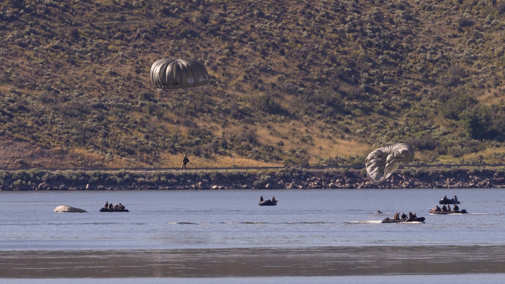 Soldiers with the 19th Special Forces Group (Airborne) parachute into Deer Creek Reservoir near Heber City, Utah