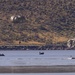 Soldiers with the 19th Special Forces Group (Airborne) parachute into Deer Creek Reservoir near Heber City, Utah