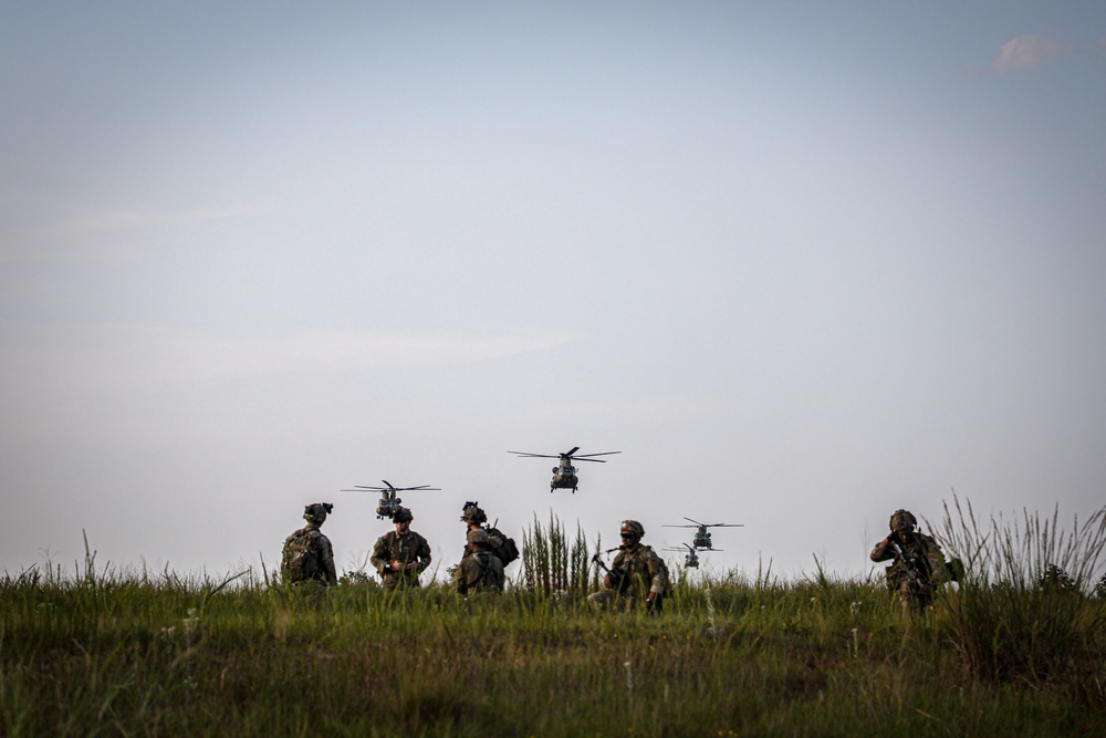 Paratroopers Conduct Load Up Onto Helicopter In Preparation For Air Assault