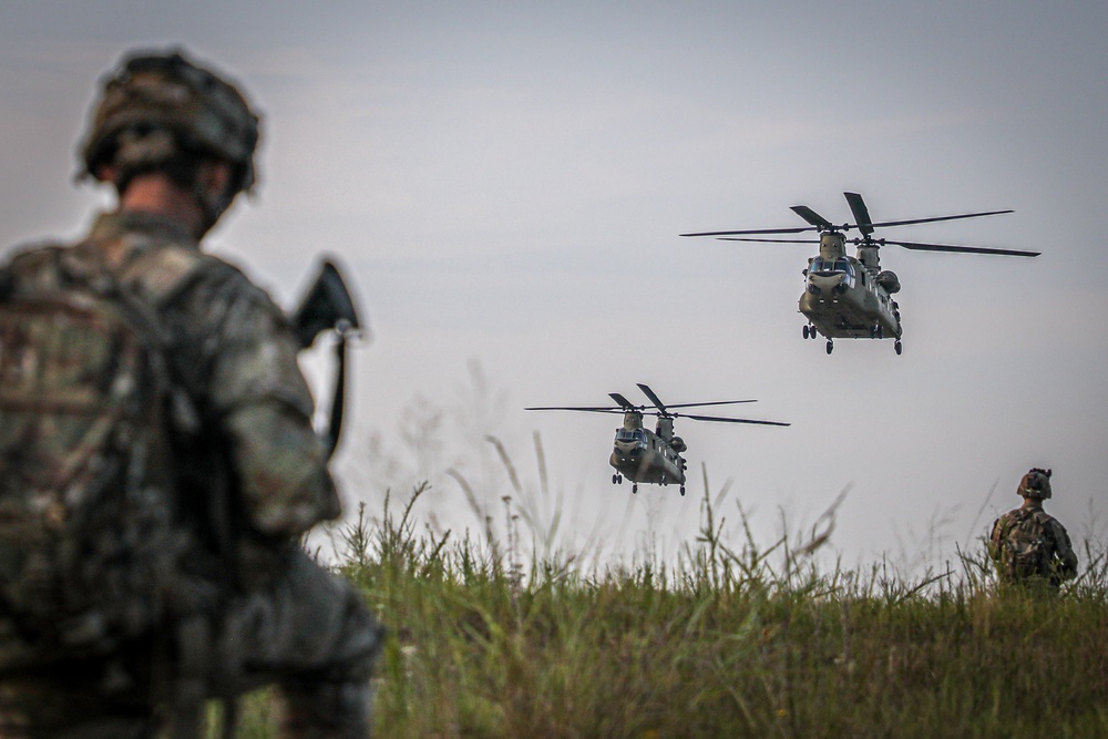 Paratroopers Conduct Load Up Onto Helicopter In Preparation For Air Assault