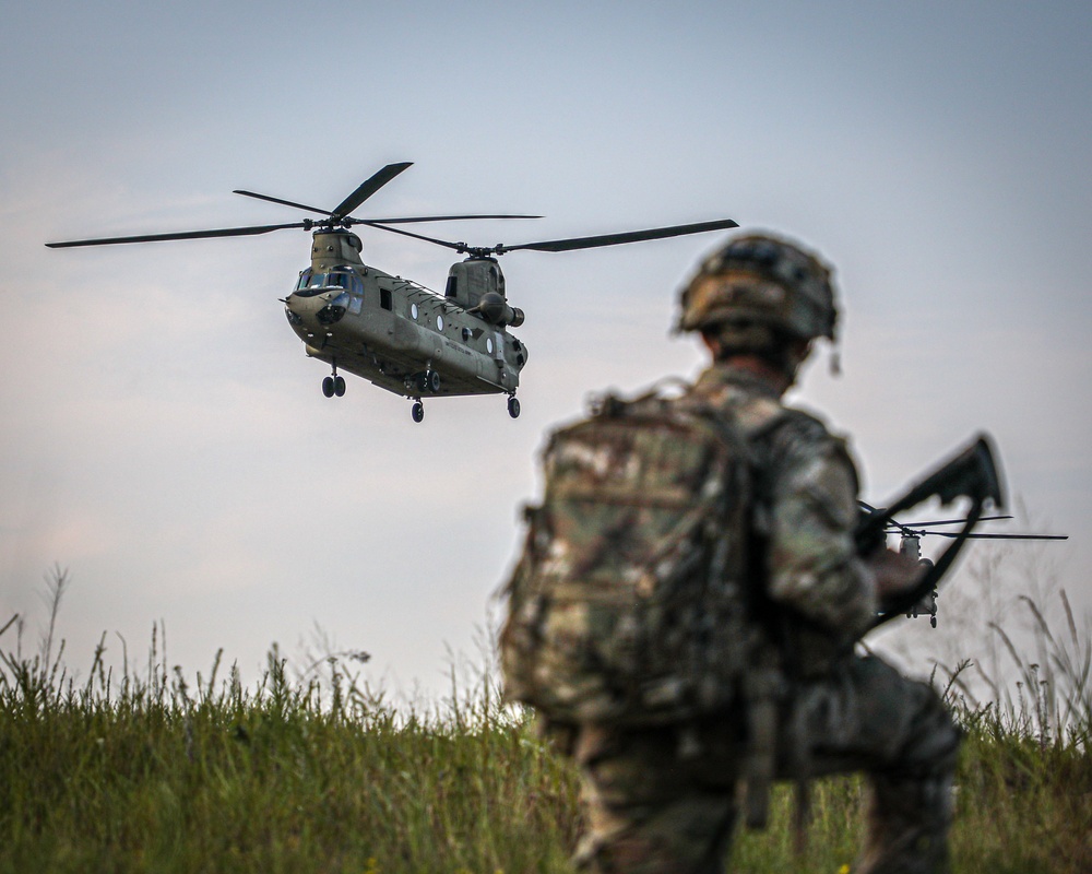 Paratroopers Conduct Load Up Onto Helicopter In Preparation For Air Assault