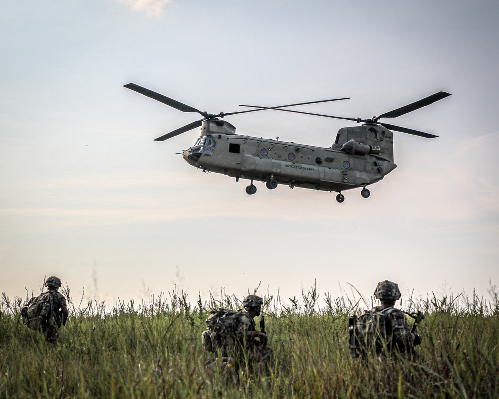 Paratroopers Conduct Load Up Onto Helicopter In Preparation For Air Assault