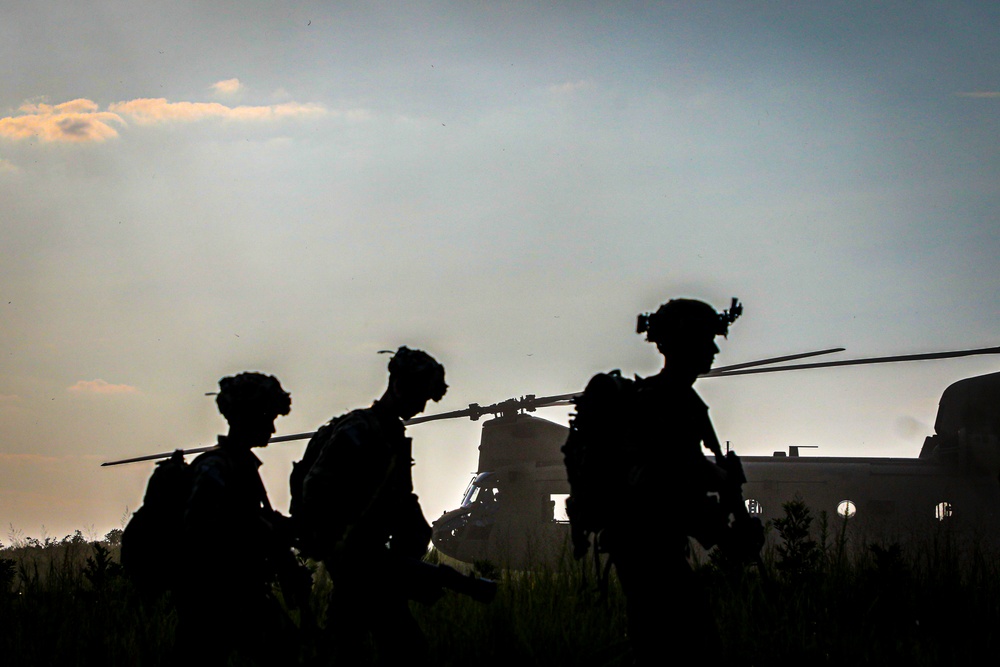 Paratroopers Conduct Load Up Onto Helicopter In Preparation For Air Assault