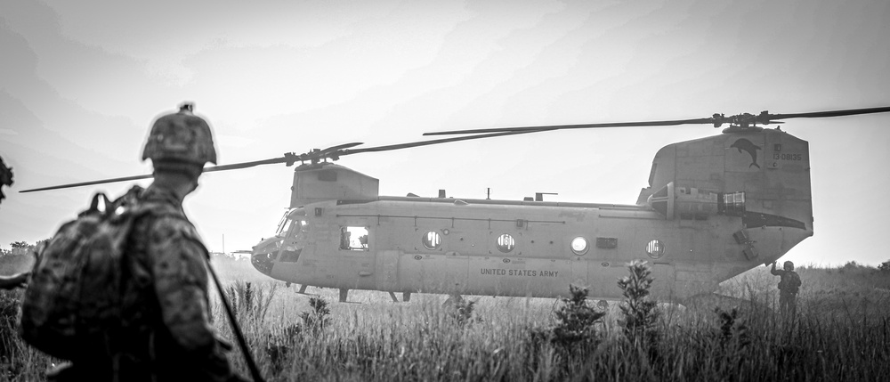 Paratroopers Conduct Load Up Onto Helicopter In Preparation For Air Assault