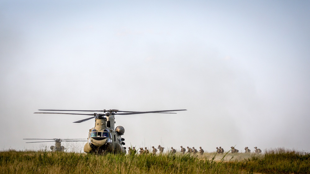 Paratroopers Conduct Load Up Onto Helicopter In Preparation For Air Assault