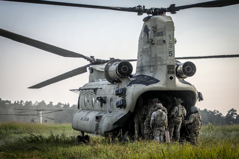 Paratroopers Conduct Load Up Onto Helicopter In Preparation For Air Assault