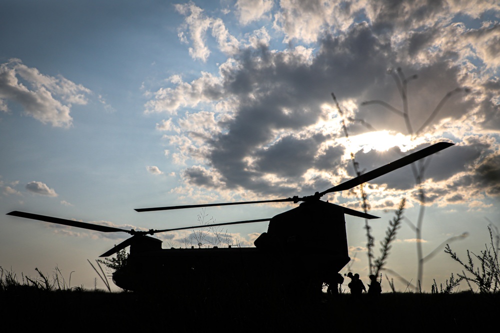 Paratroopers Conduct Load Up Onto Helicopter In Preparation For Air Assault