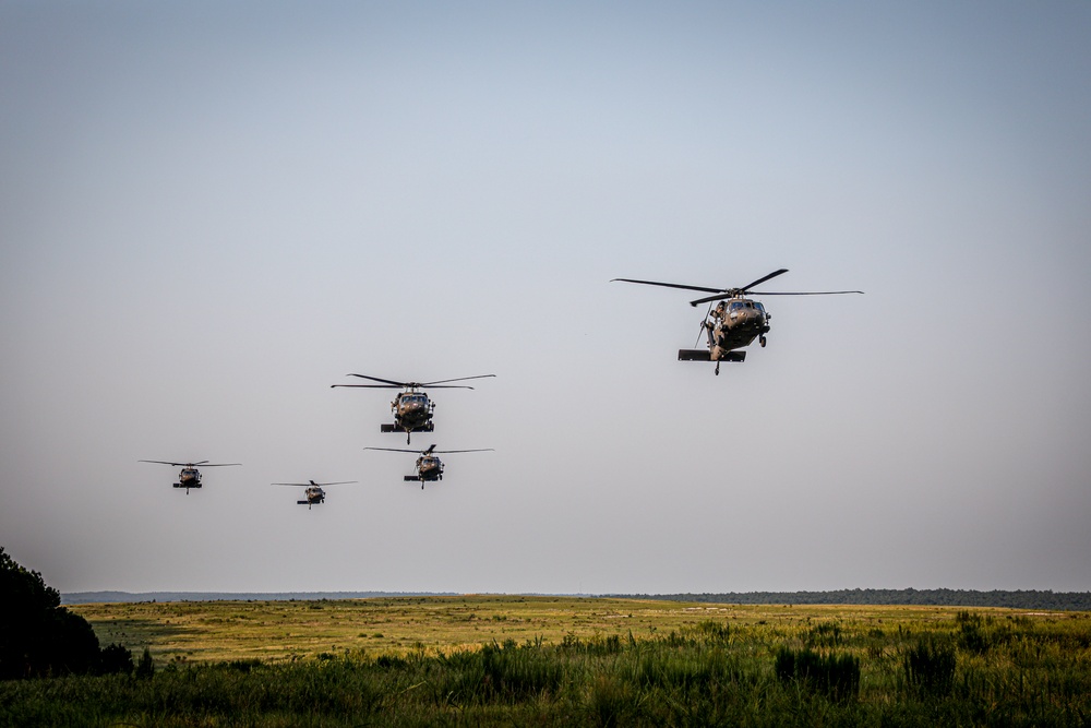 Paratroopers Conduct Load Up Onto Helicopter In Preparation For Air Assault