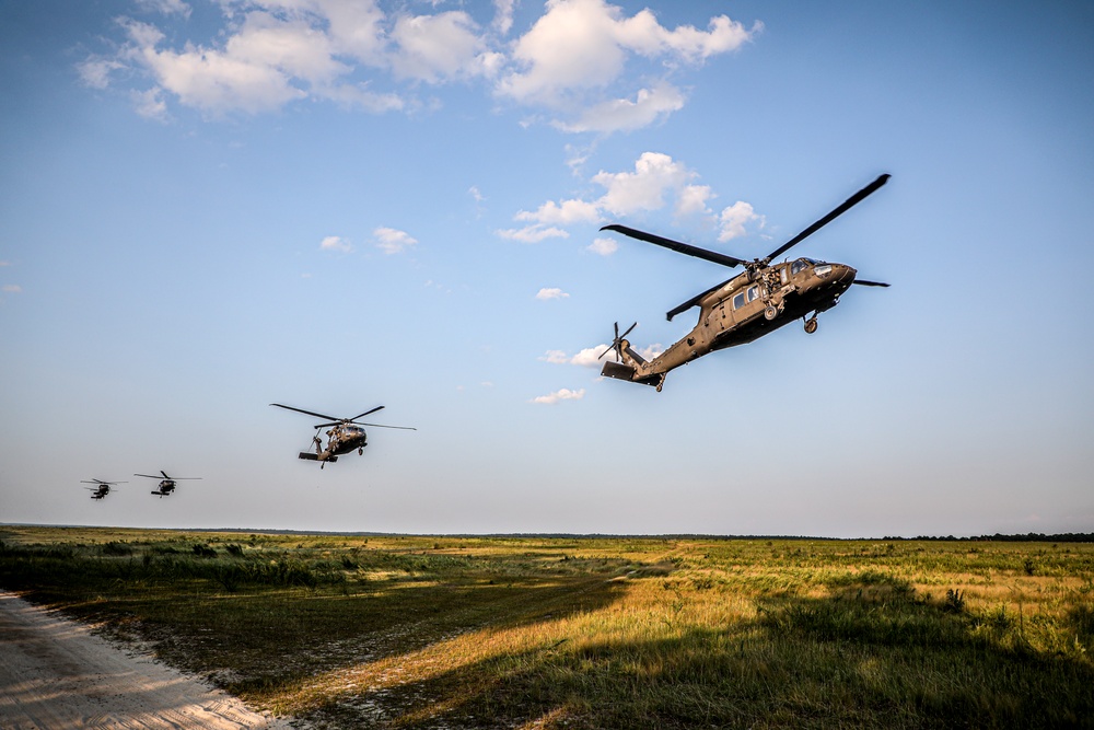 Paratroopers Conduct Load Up Onto Helicopter In Preparation For Air Assault