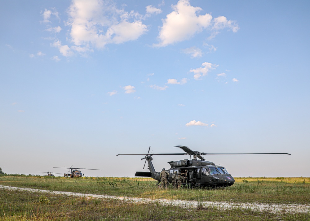 Paratroopers Conduct Load Up Onto Helicopter In Preparation For Air Assault