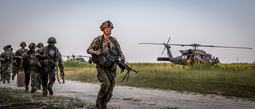 Paratroopers Conduct Load Up Onto Helicopter In Preparation For Air Assault