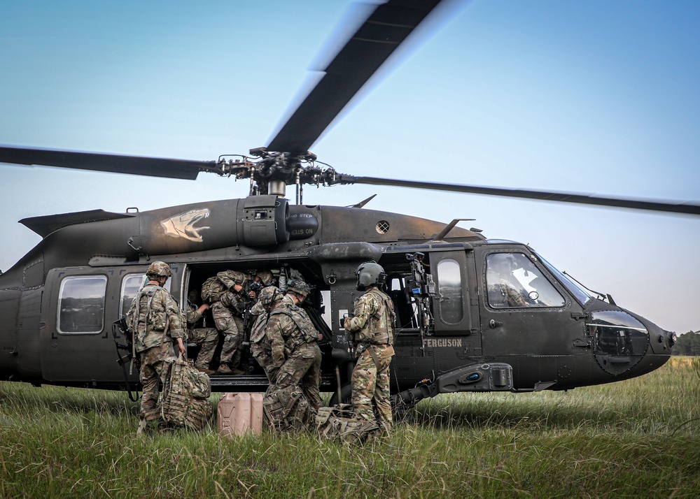 Paratroopers Conduct Load Up Onto Helicopter In Preparation For Air Assault