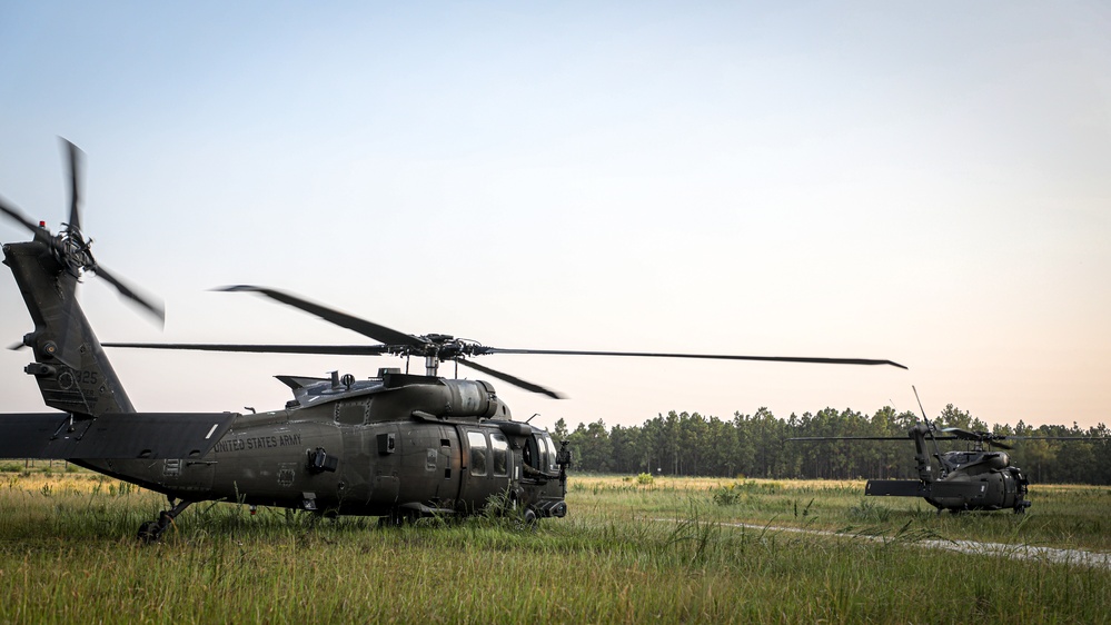 Paratroopers Conduct Load Up Onto Helicopter In Preparation For Air Assault