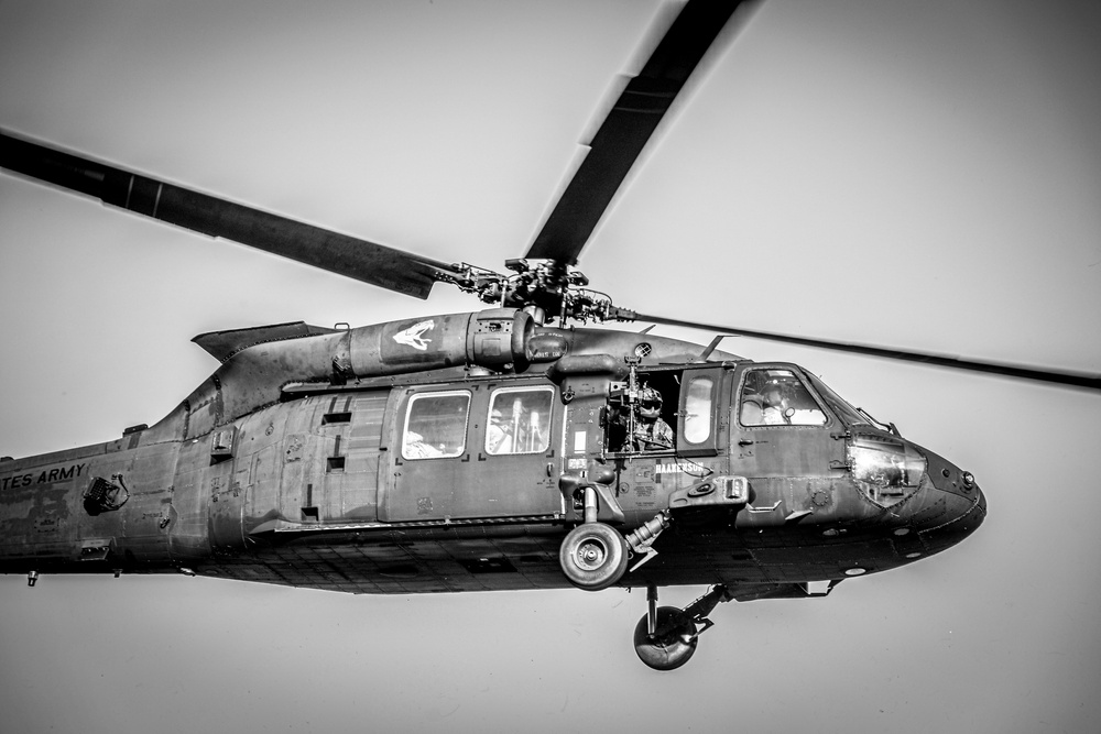 Paratroopers Conduct Load Up Onto Helicopter In Preparation For Air Assault