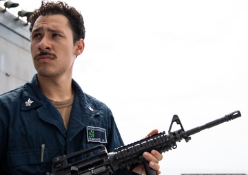 USS Ralph Johnson hosts weapons familiarization training.