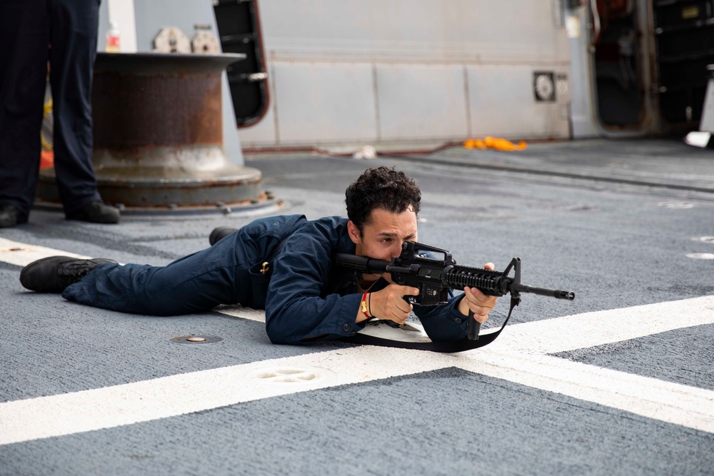 USS Ralph Johnson hosts weapons familiarization training.