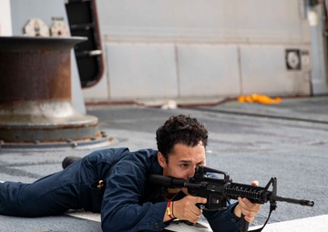 USS Ralph Johnson hosts weapons familiarization training.