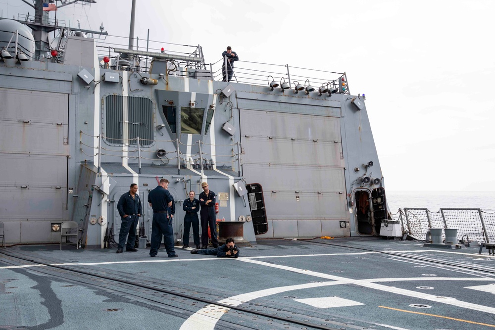 USS Ralph Johnson hosts weapons familiarization training.