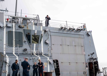 USS Ralph Johnson hosts weapons familiarization training.