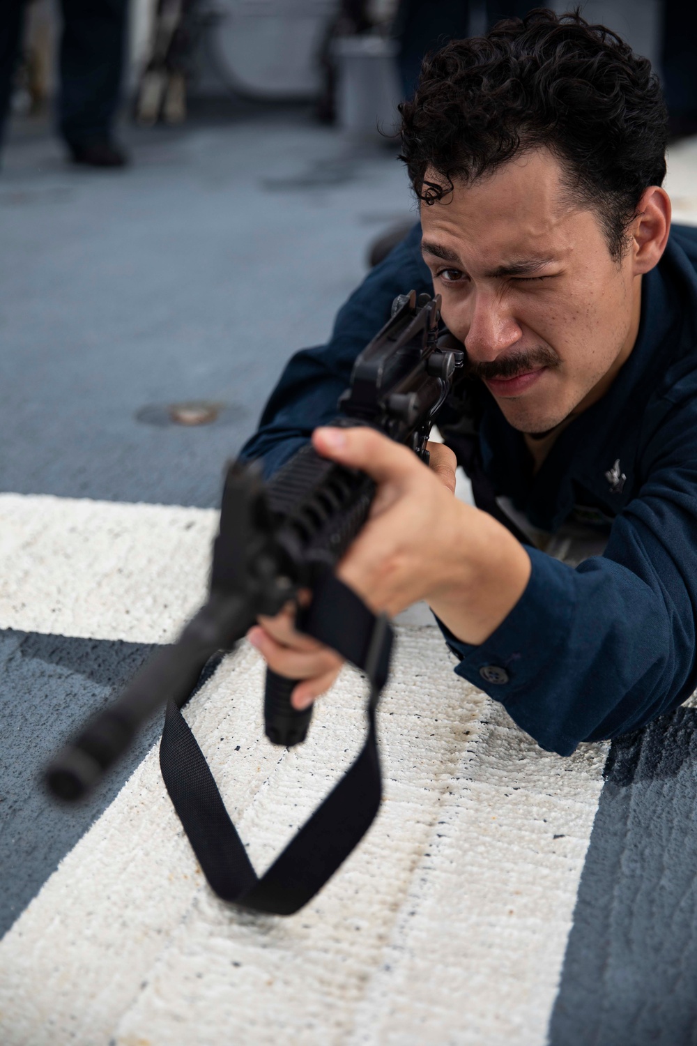 USS Ralph Johnson hosts weapons familiarization training.