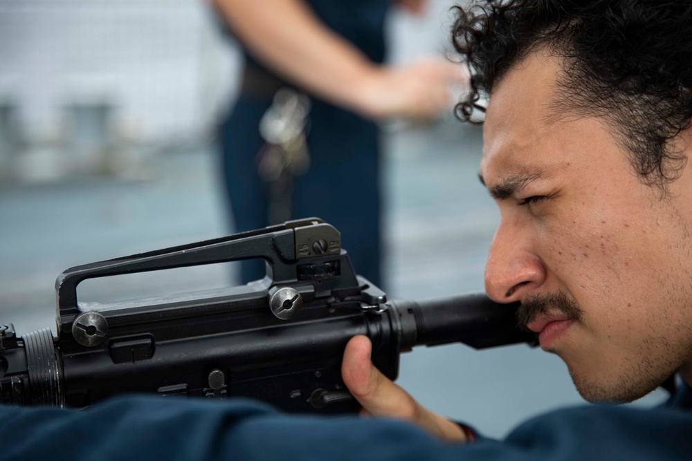 USS Ralph Johnson hosts weapons familiarization training.