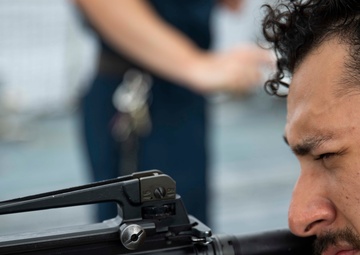 USS Ralph Johnson hosts weapons familiarization training.