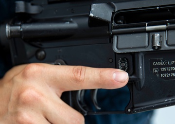 USS Ralph Johnson hosts weapons familiarization training.