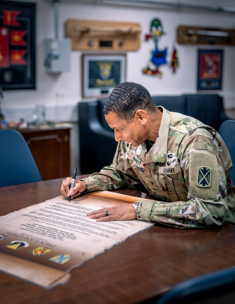 10th AAMDC commanding general signs proclamation for Suicide Prevention Month