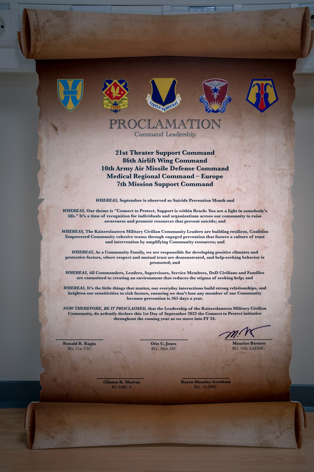 10th AAMDC commanding general signs proclamation for Suicide Prevention Month