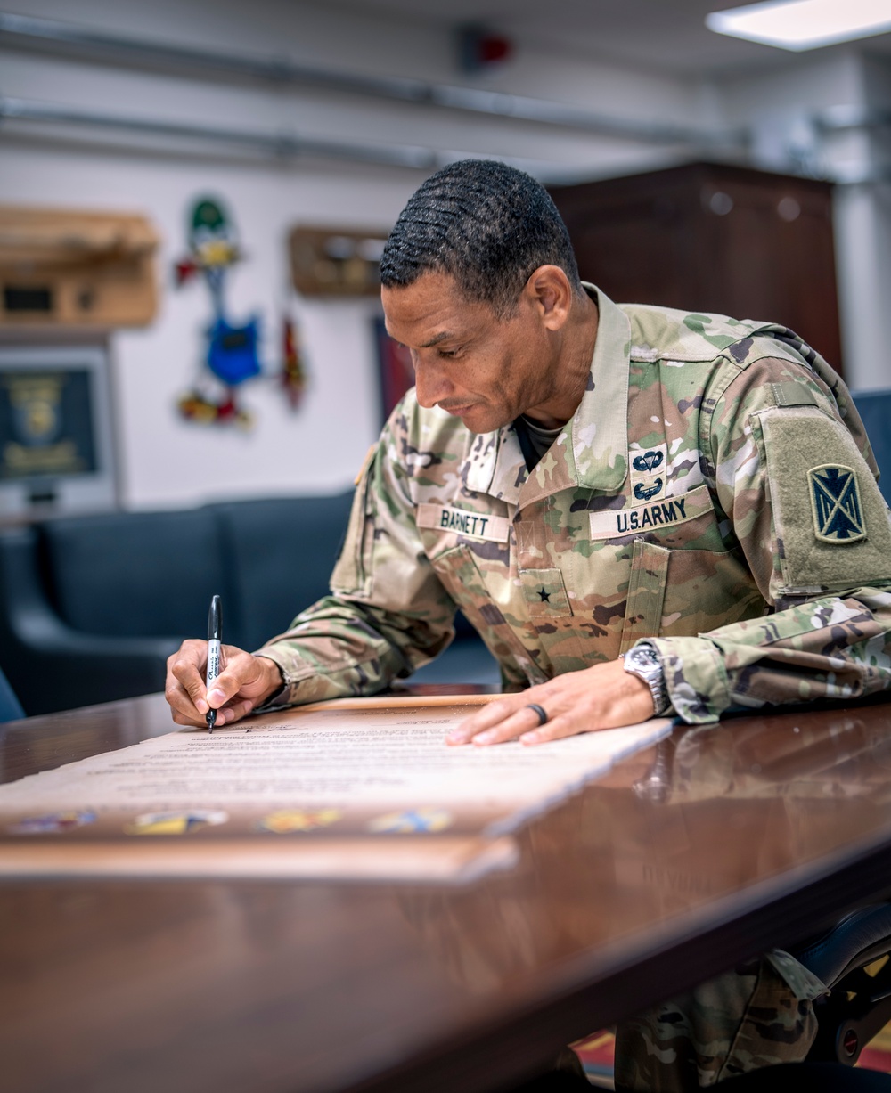 10th AAMDC commanding general signs proclamation for Suicide Prevention Month