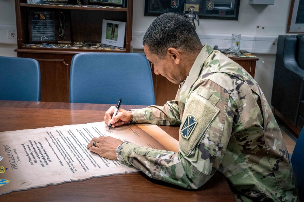 10th AAMDC commanding general signs proclamation for Suicide Prevention Month